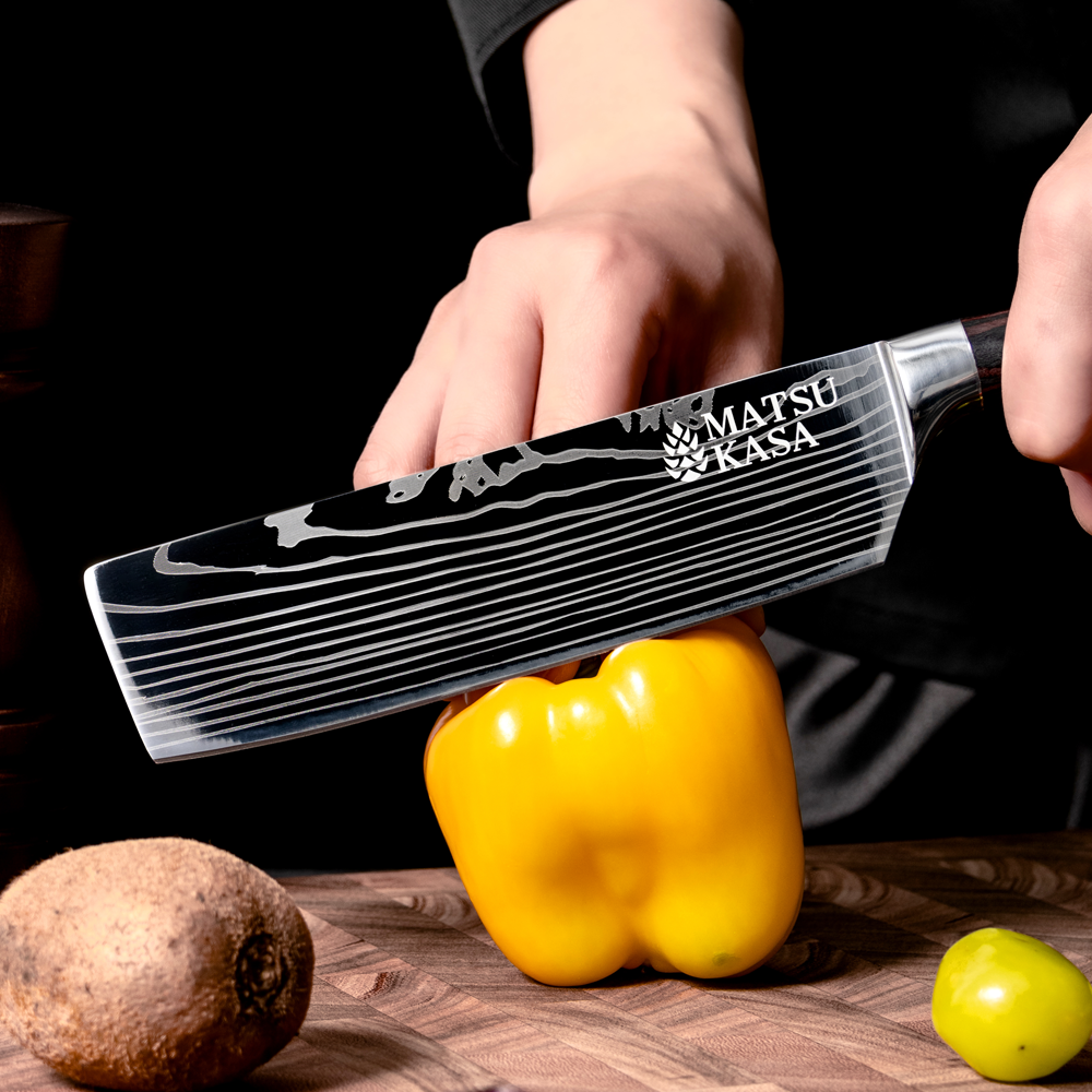 MATSUKASA nakiri cutting through a yellow pepper