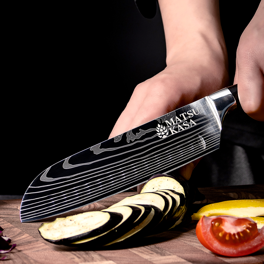 A MATSUKASA santoku slicing through eggplant